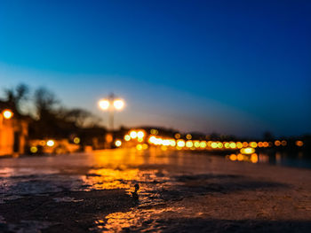 Defocused image of illuminated city at night