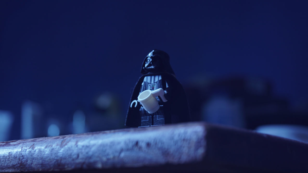 blue, darkness, light, night, one person, macro photography, close-up, focus on foreground, black