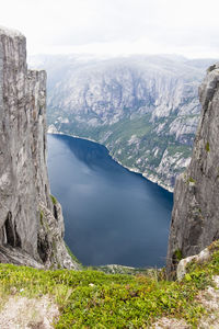 High angle view of sea and mountains against sky