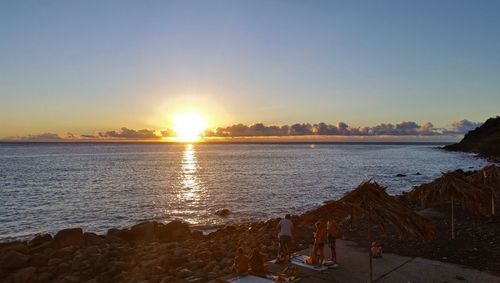 Scenic view of sea against clear sky during sunset