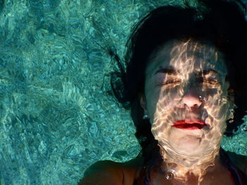 Close-up of woman in swimming pool