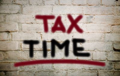 Close-up of graffiti on wall - tax time