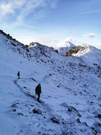 Scenic view of snow covered mountain against sky