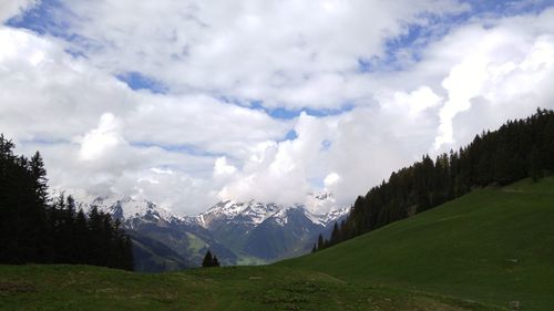 Scenic view of landscape against cloudy sky