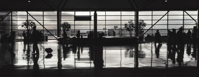 Panoramic view of people at airport