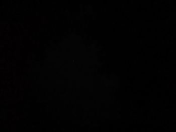 Low angle view of moon against sky at night