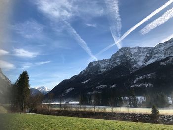 Scenic view of vapor trails against sky