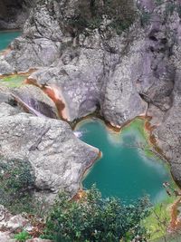 High angle view of rocks in lake