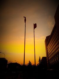 Silhouette street light against sky during sunset