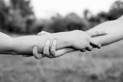 Close-up of woman hand with hands outdoors