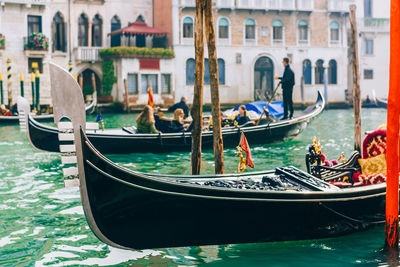 Boats moored in canal