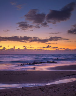 Scenic view of beach against sky during sunset sicily 