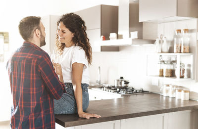 Friends standing at home