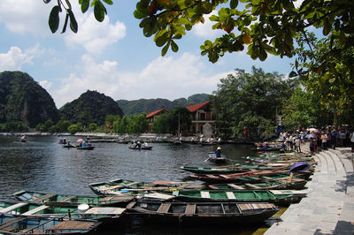 Boats moored in river