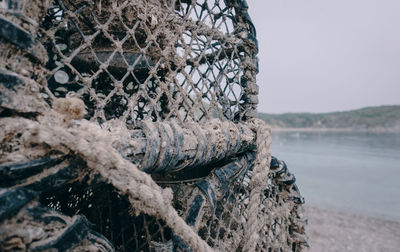 Close-up of fishing net on beach