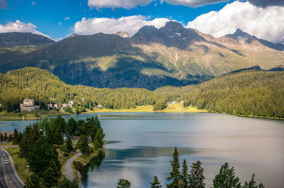 Scenic view of lake and mountains against sky