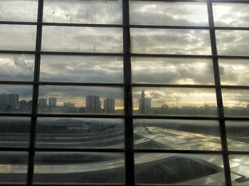 View of cityscape seen through window