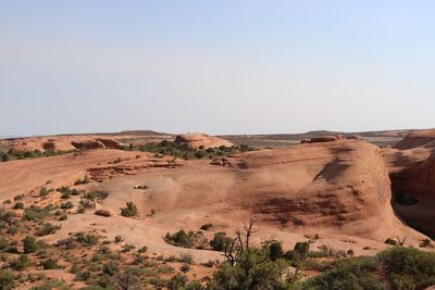 Scenic view of rock formations at arches national park against sky