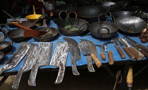 Market stall with sharp knives and kitchen utensils