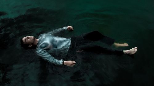 High angle view of man swimming in lake