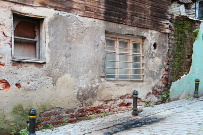 Man on window of building