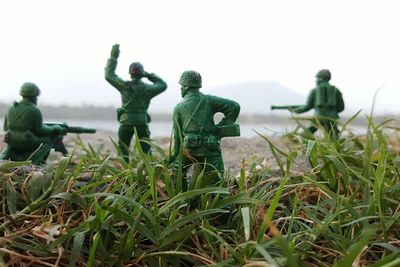 Close-up of toy soldiers on grass