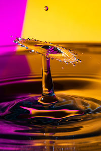 Close-up of drop splashing on water