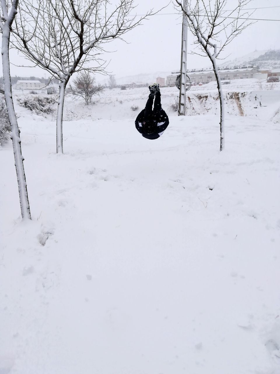 snow, cold temperature, winter, white color, tree, field, covering, nature, land, bare tree, plant, day, beauty in nature, scenics - nature, mode of transportation, tranquility, transportation, no people, non-urban scene, warm clothing, snowcapped mountain