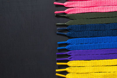 High angle view of colored pencils on black background