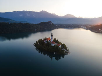 Aerial view of cerkev marijinega, a catholic church on a small island in the middle of bled lake