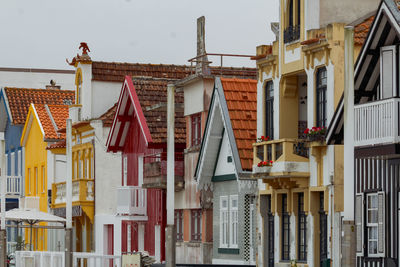 Typical colourful houses with stripes in costa nova - aveiro against sky