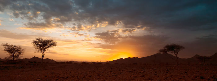 Scenic view of silhouette landscape against sky during sunset