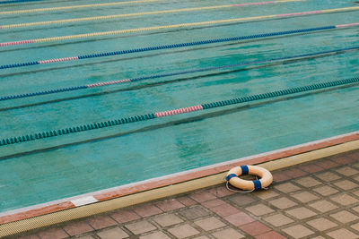 High angle view of man relaxing in swimming pool