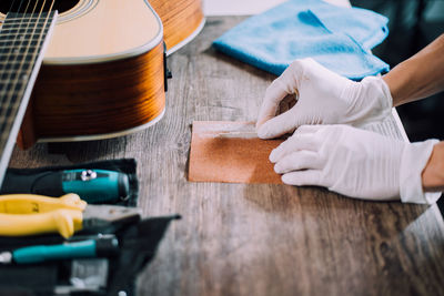 Close-up of man working on table