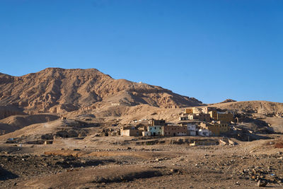 Scenic view of mountains against clear blue sky