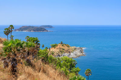 Scenic view of sea against clear blue sky