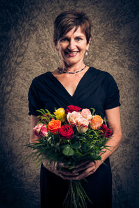 Woman holding flower bouquet