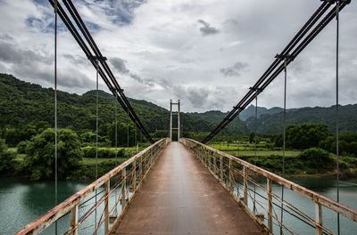 Narrow suspension bridge near phong nha vietnam