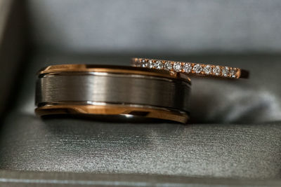 Close-up of wedding rings on table