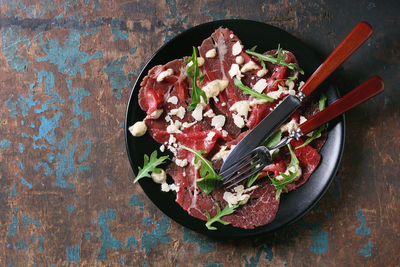 Directly above shot of meat in plate on table