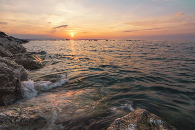 Scenic view of sea against sky during sunset