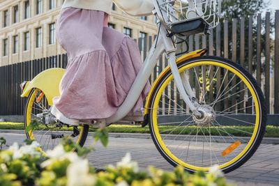 Man with bicycle on street in city