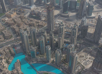 High angle view of swimming pool by buildings in city