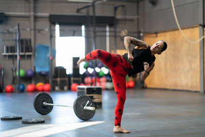 Low section of man exercising in gym