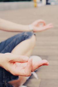 Close-up of woman hand over blurred background