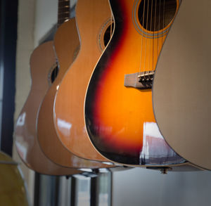 Guitars hanging in a row