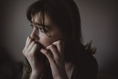 Close-up of worried woman looking away