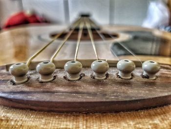 Close-up of guitar on table