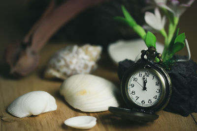 Close-up of clock on table