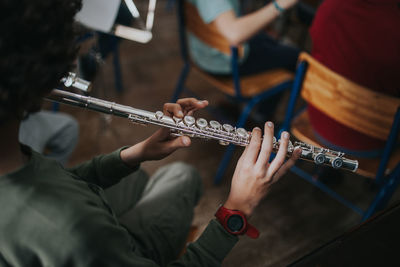 High angle view of man playing flute